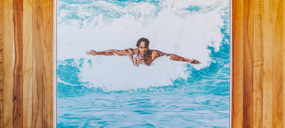 Duke surfing a wave